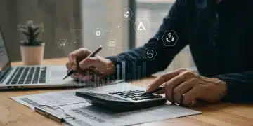 Investor reviewing tax documents with calculator and financial data